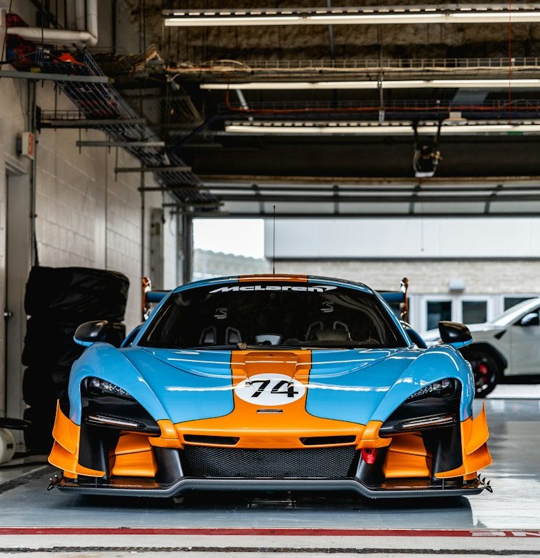 orange lamborghini aventador parked in garage
