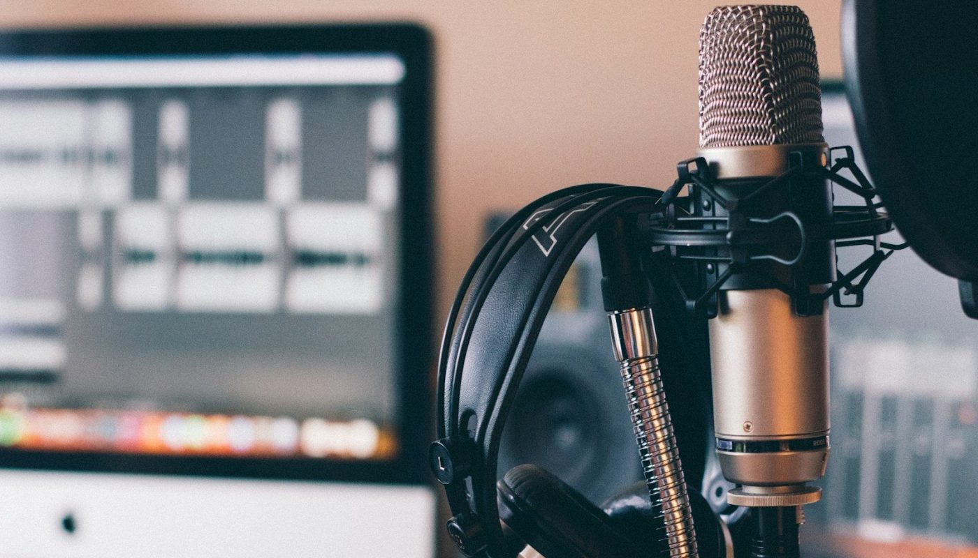 black and silver headphones on black and silver microphone